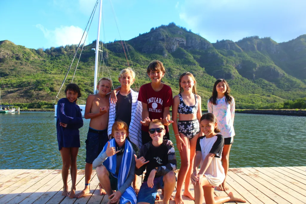 Children learning to sail on small boats
