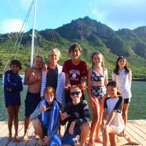 Children learning to sail on small boats