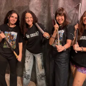 Person wearing protective gear in a rage room