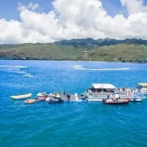 People enjoying jet skiing on clear Hawaiian waters