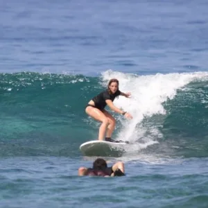 Couple taking semi-private surf lesson in Kailua-Kona