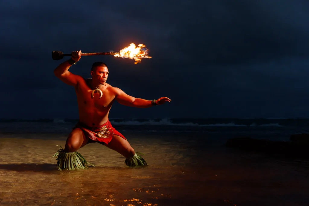 Audience seated at outdoor luau event in Kauai