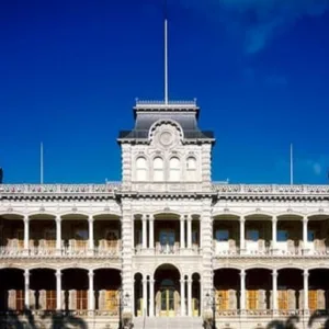 Luxury limousine parked outside historic Iolani Palace