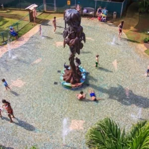 Children playing with water toys at botanical gardens