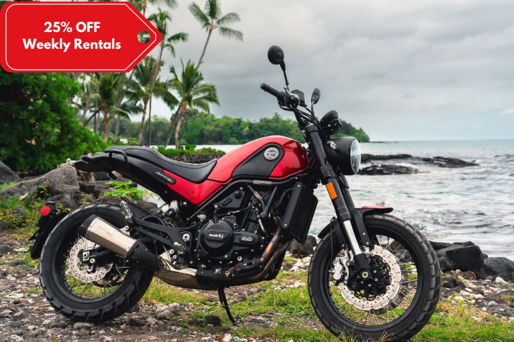 Benelli 500cc motorcycle parked near tropical scenery