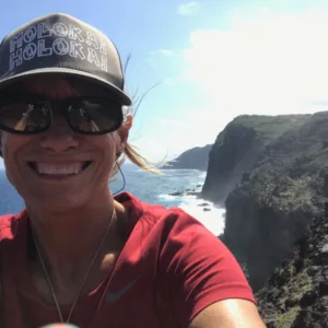 Visitors walking along sandy dunes at cultural site