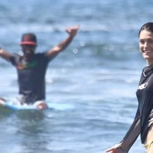 Surfer catching a wave during private lesson in Lahaina