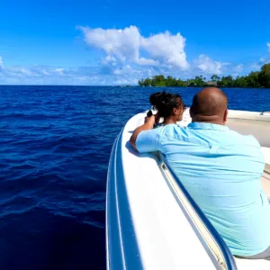 Private boat cruising along East Hawaii coastline
