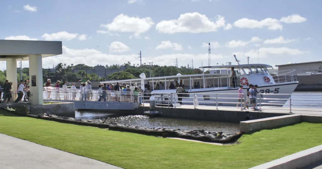 USS Arizona Memorial spanning over calm harbor waters