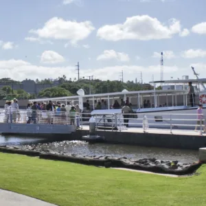 USS Arizona Memorial spanning over calm harbor waters