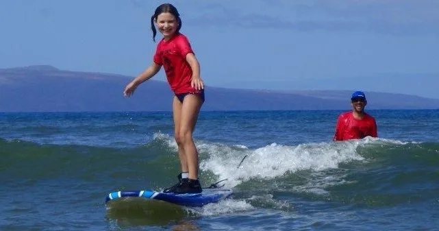 Children participating in surf camp lessons in Kihei