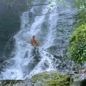Hikers exploring waterfall trail on Oahu