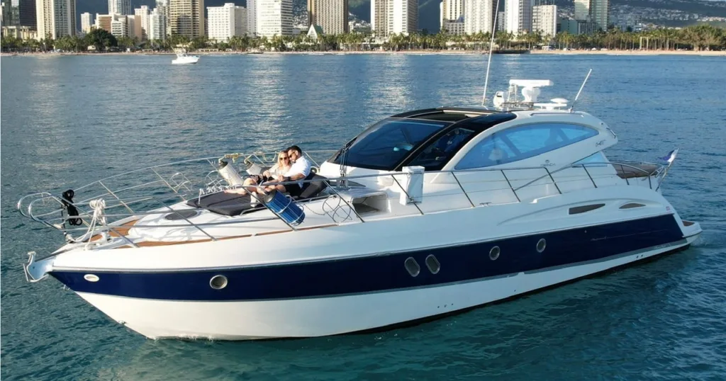 Luxury yacht cruising near Waikiki shore