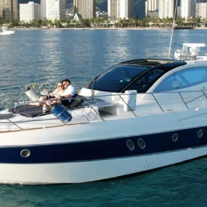 Luxury yacht cruising near Waikiki shore