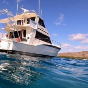 Cabin cruiser anchored at Kaneohe Bay sandbar