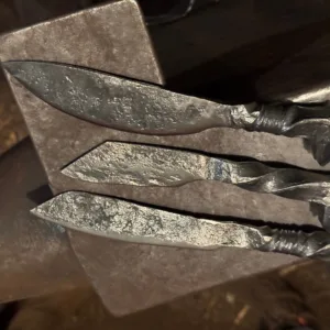Participant forging a railroad spike knife