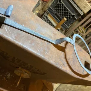 Participant forging metal to create bubble wand