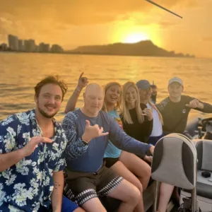Small private boat cruising along Waikiki shoreline