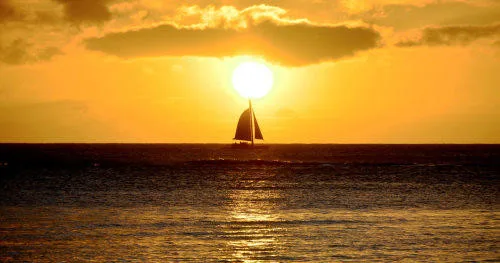 Catamaran sailing at sunset near Ko Olina Marina