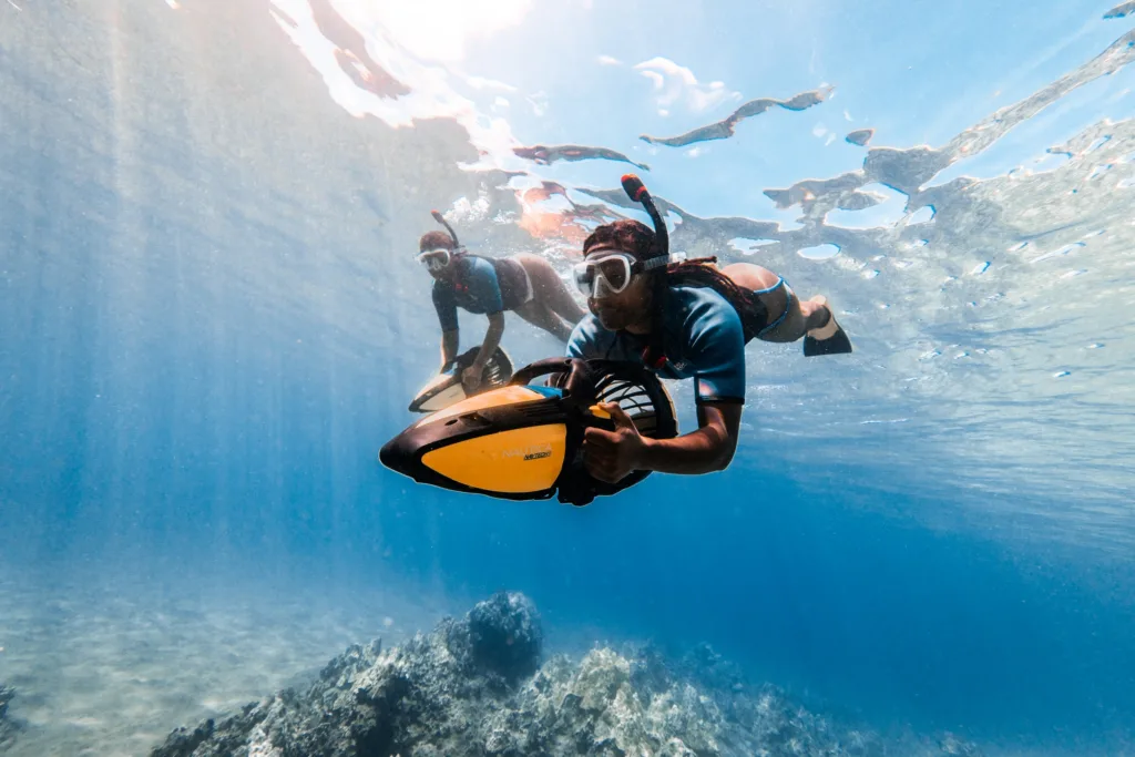 Couple snorkeling near coral reef