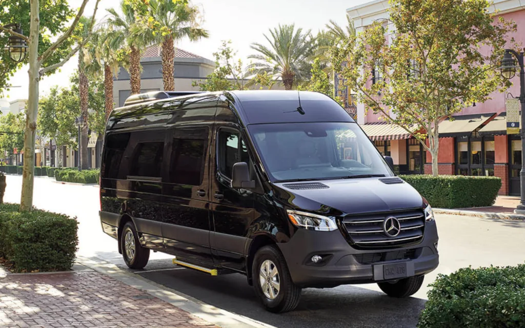 Shuttle van parked outside Honolulu airport terminal