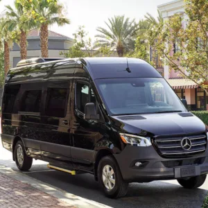 Shuttle van parked outside Honolulu airport terminal