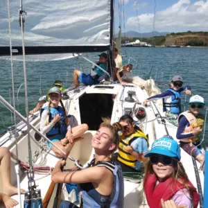 Children painting ocean-themed art projects indoors