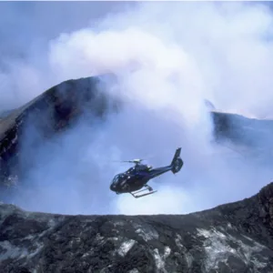 Helicopter flying over volcanic landscape on Big Island