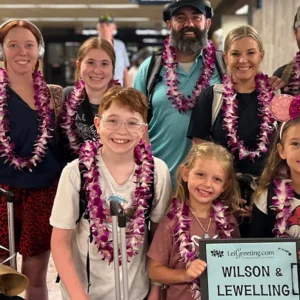 Group greeted with fresh leis at Honolulu Airport arrival