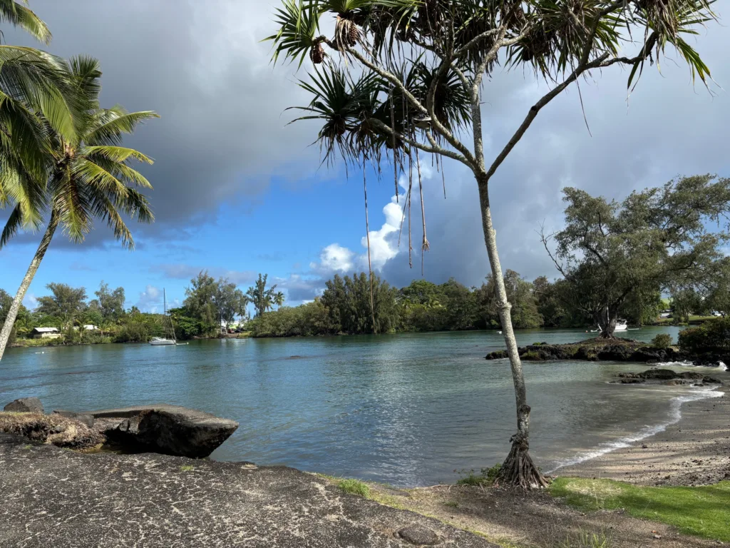 Person learning stand up paddleboarding in calm bay