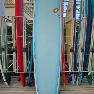 9ft8in Schaper epoxy surfboard resting near locker