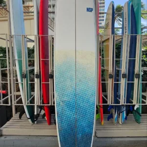 Long 11-foot epoxy surfboard resting near locker