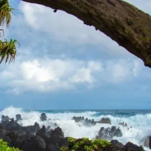 Hikers exploring waterfalls along Hana Highway