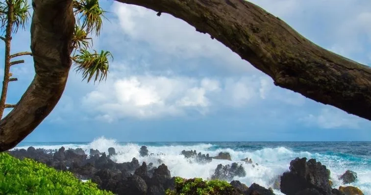 Hikers exploring waterfalls along Hana Highway