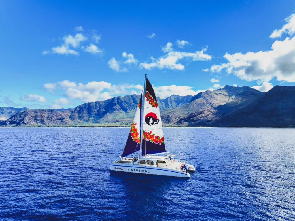 Guests enjoying live Hawaiian music at sunset dockside