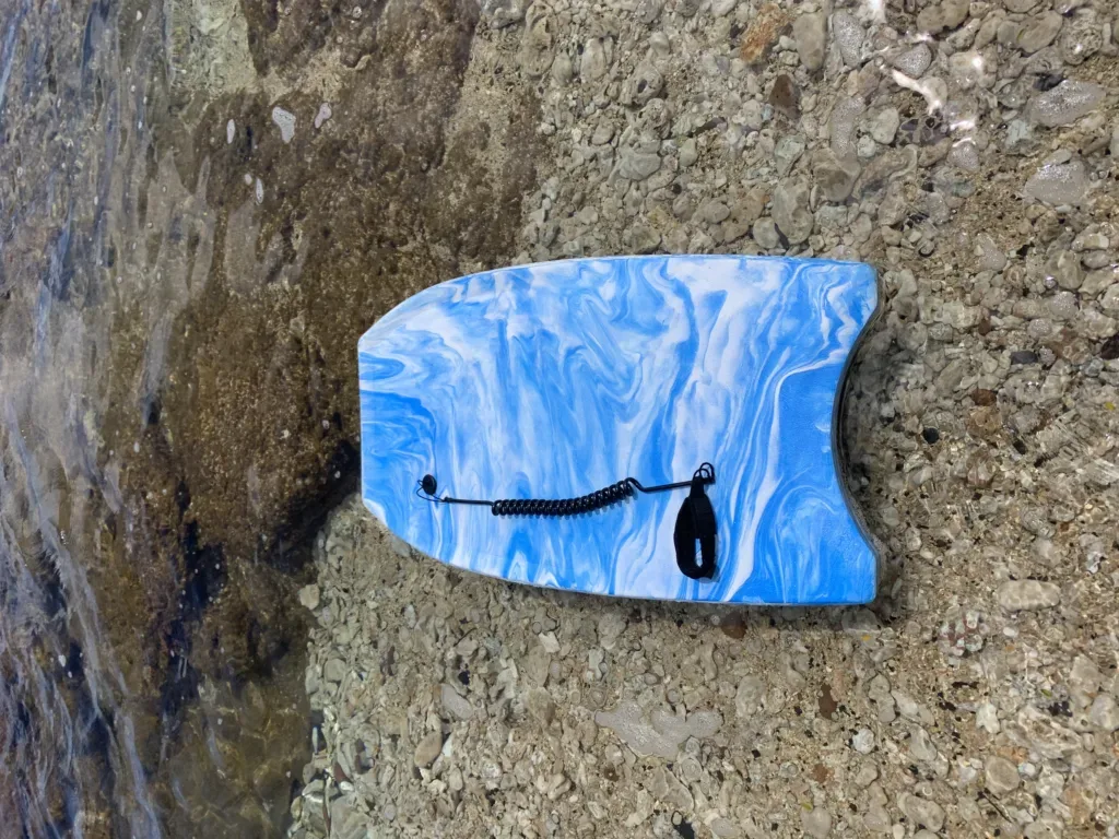 Medium sized boogie board on sandy beach