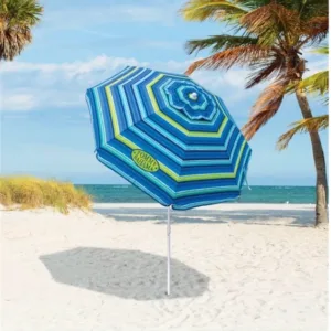 Large Tommy Bahamas beach umbrella set up on sand