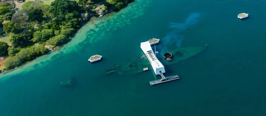 USS Arizona Memorial floating above sunken battleship