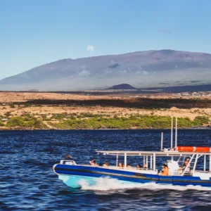 Leisurely cruise along Kohala coastline at sunset