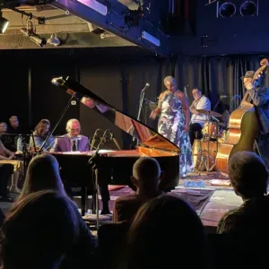 Jazz band performing on stage with instruments