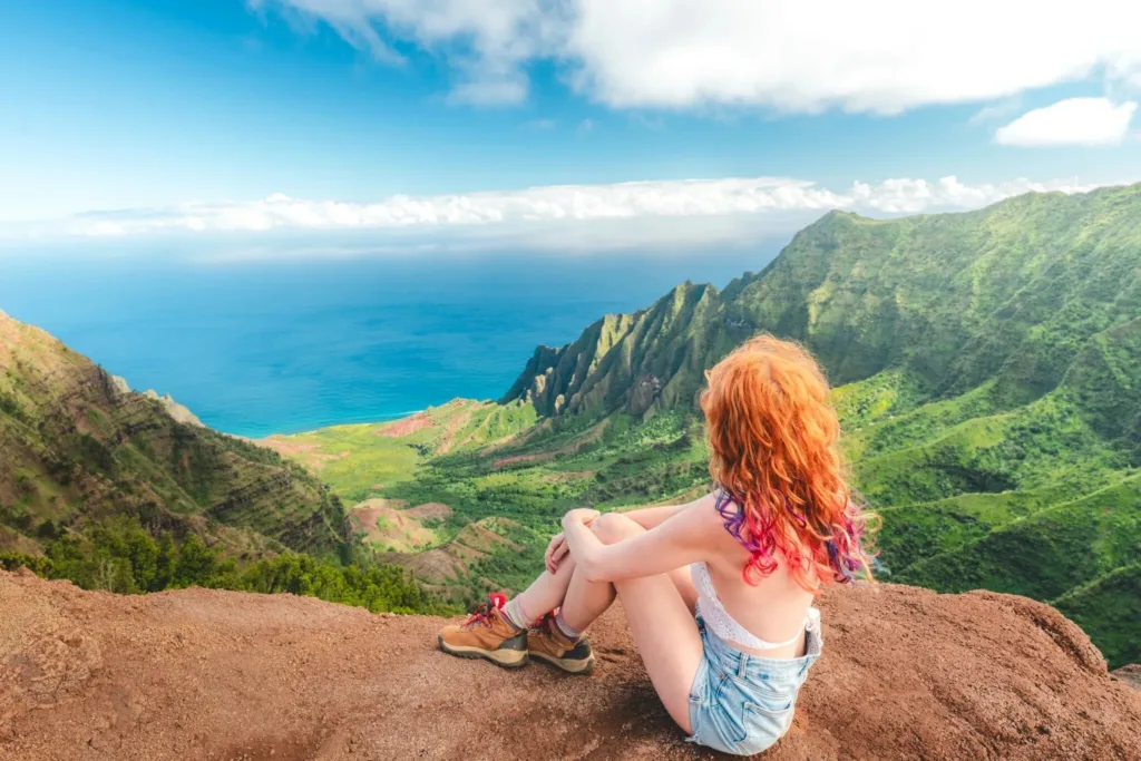 Scenic Kauai beach with lush green mountains
