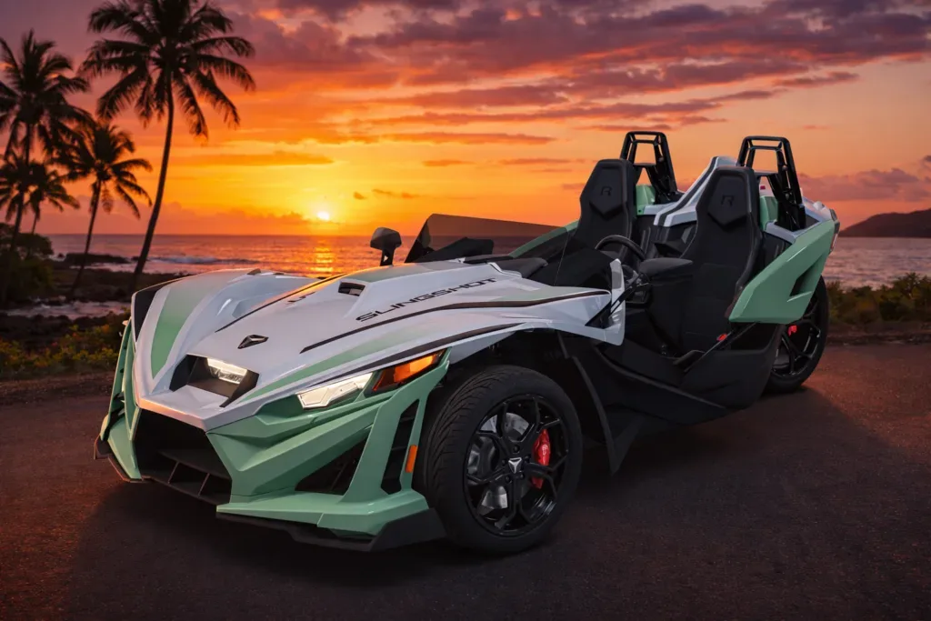 Polaris Slingshot vehicle driving along Waikiki coastline