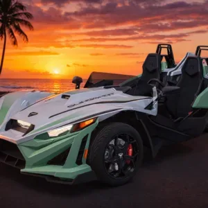 Polaris Slingshot vehicle driving along Waikiki coastline