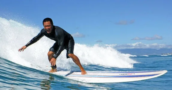 Various surfboards available for rent on beach