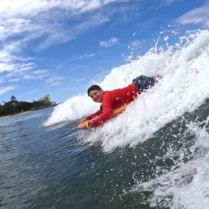 Instructor teaching bodyboarding on Waikiki beach