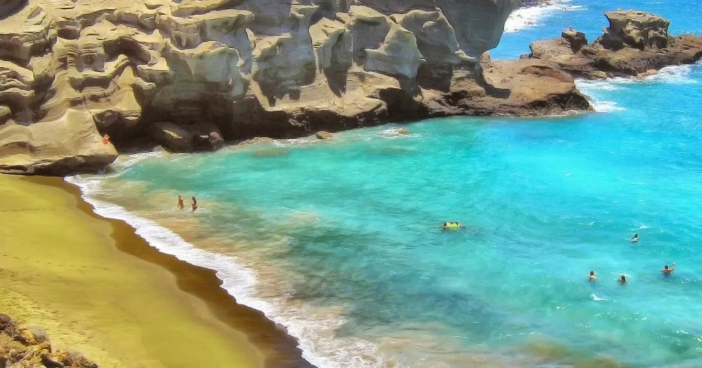 Boat on calm harbor water at sunset