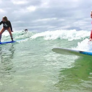 Beginner surfer learning to ride waves