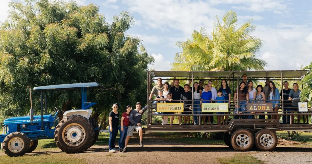 Farm tour wagon moving through Kahuku Farms fields