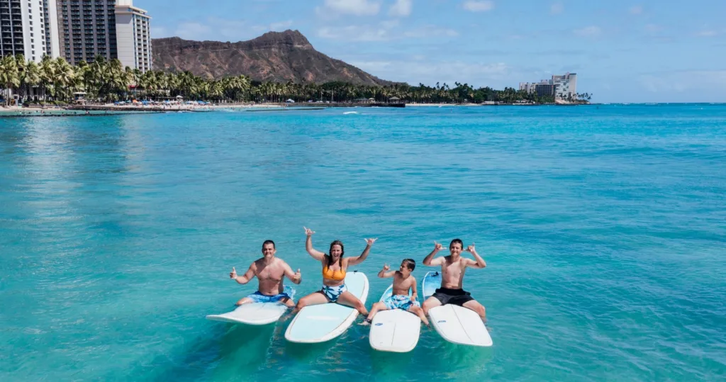 Family surfing lesson at Waikiki Beach with instructor