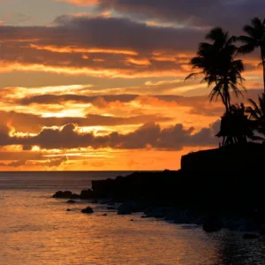 Private boat cruising during Hawaiian sunset